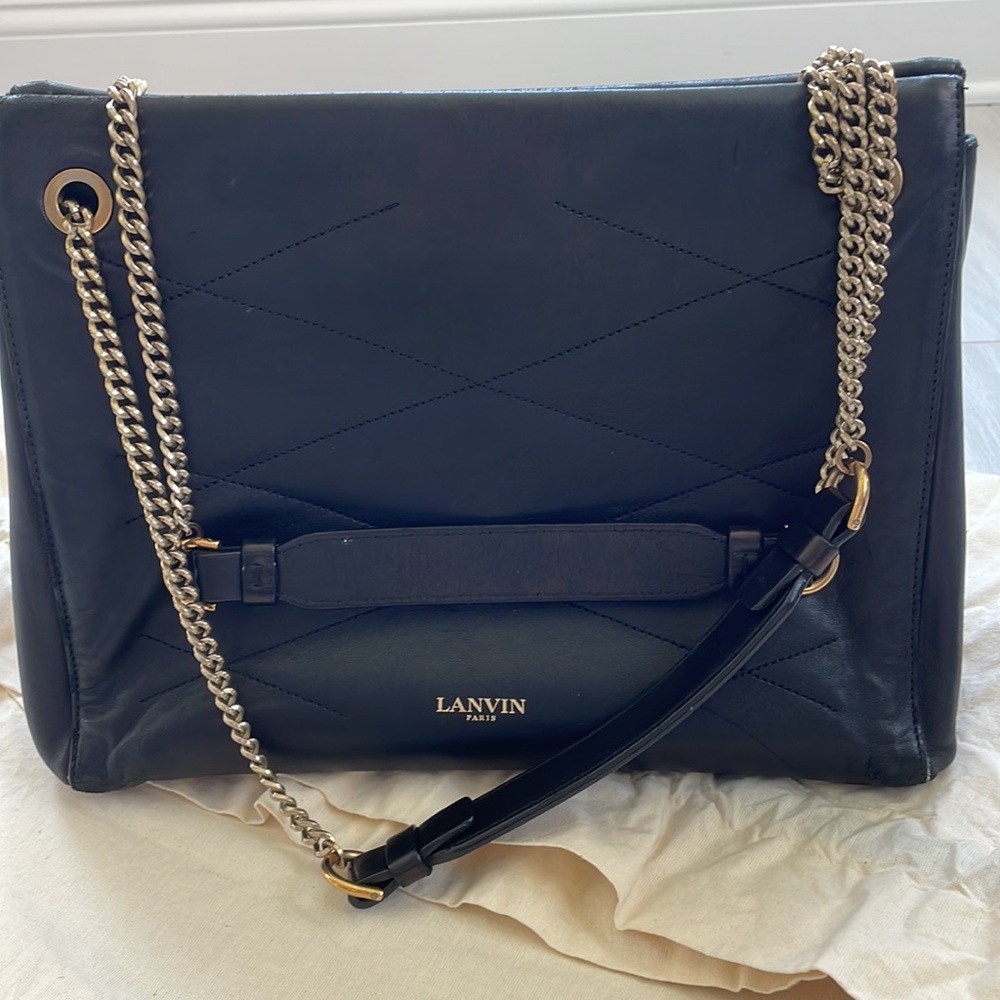 Lanvin black quilted bag with chain shoulder straps, pre owned condition.